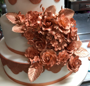 Luxury cake specially crafted sugar flowers and leaves